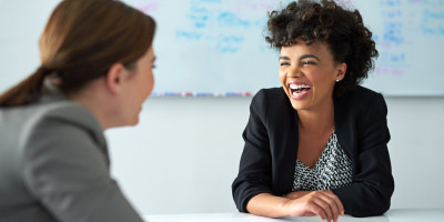 Two Women Talking in the Workplace