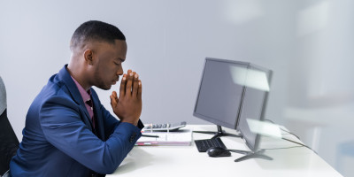 Praying at Desk