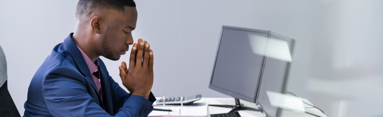 Praying at your desk.