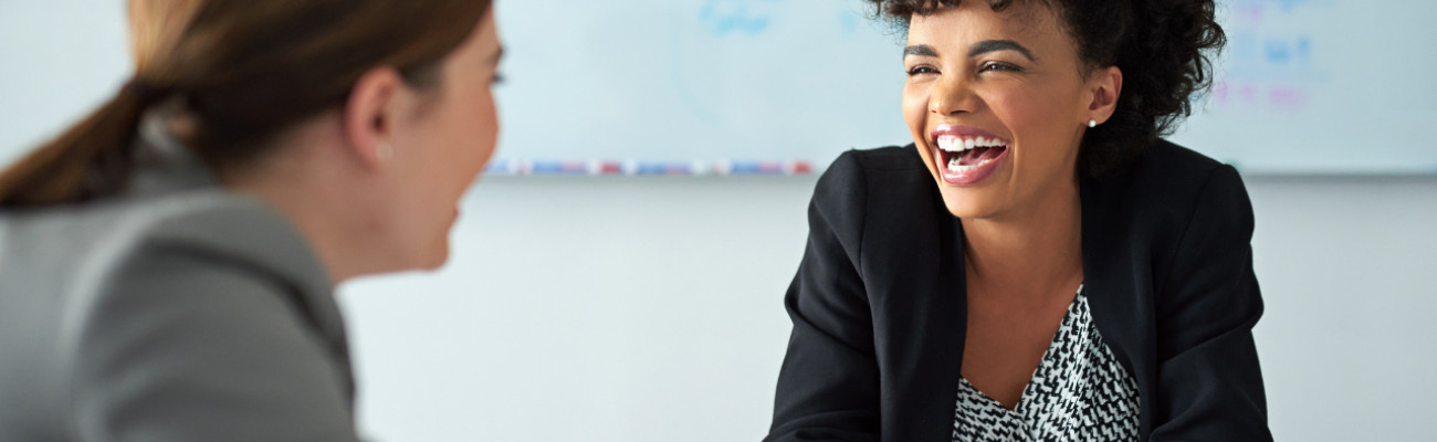 Two Women Talking in the Workplace