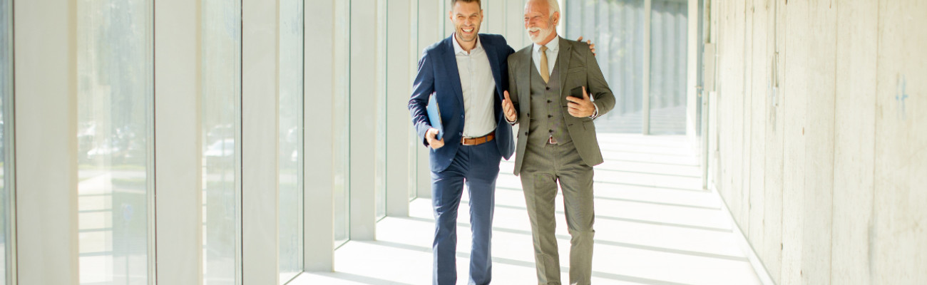 Two business men walking and talking