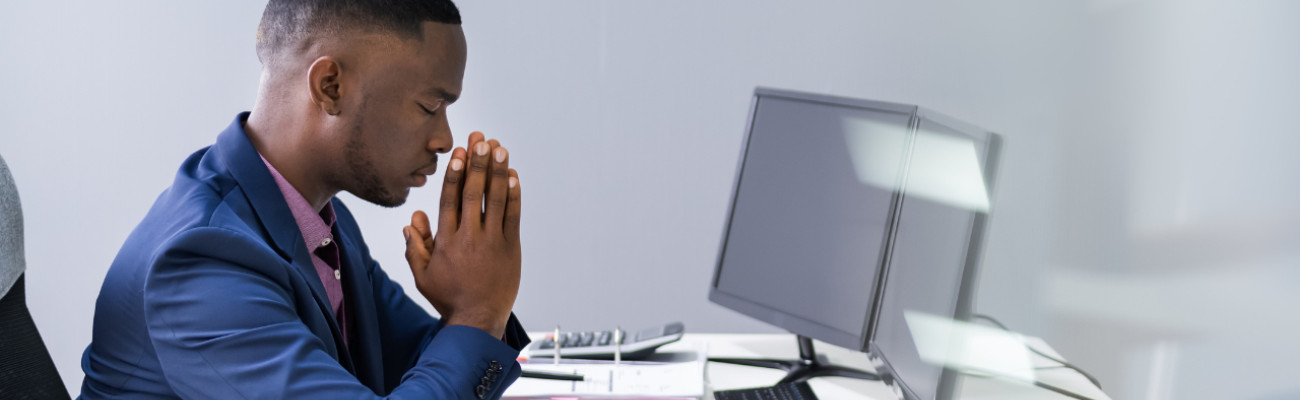 Praying at Desk